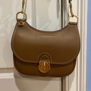 Tory Burch. Tan small saddle bag. Pristine condition.